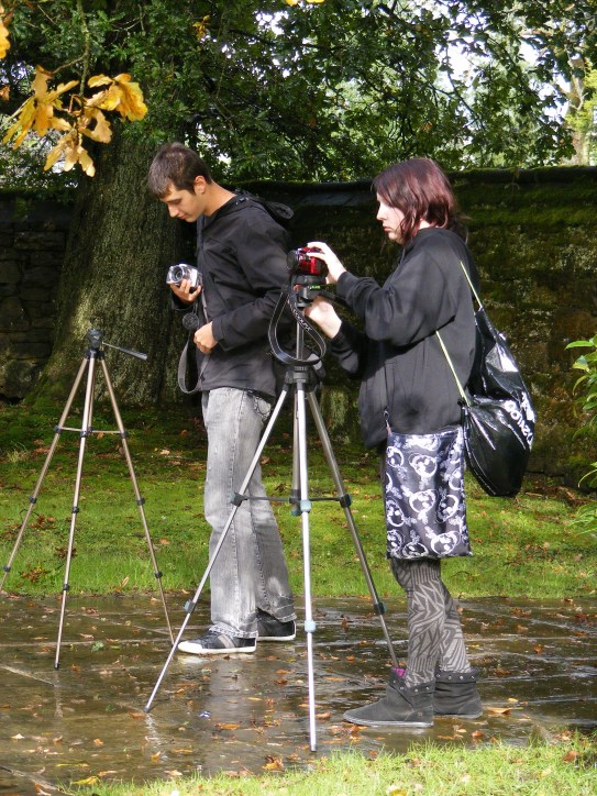 Young people taking architectural photos